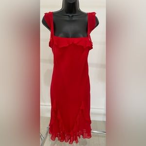 Be the life of the party in this fun, flirty , and chic red silk dress.